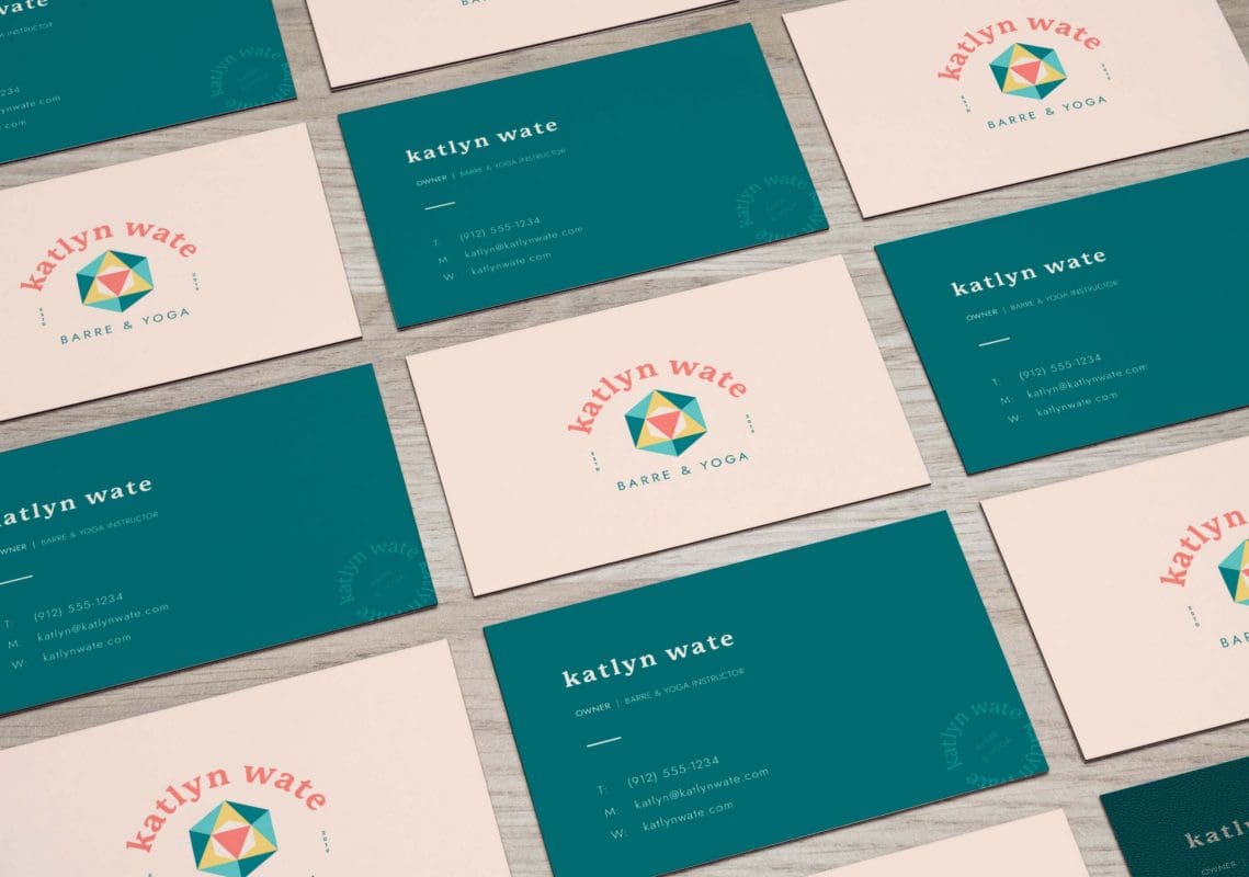 Katlyn-Wate-Barre-and-Yoga-Business-Card View from the top of business cards on a table top. They are displayed in a chckerboard fashion with the front and the back of the card alternating.